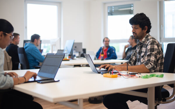 Two cybersecurity researchers in dialogue